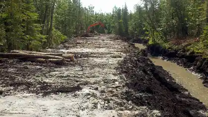 Trench cut through wet ground