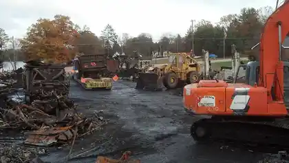 Hitachi excavator working a yard teardown