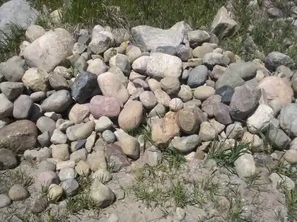 Fieldstone boulders stacked in the yard
