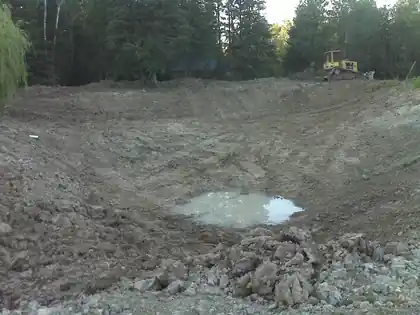 Open pond basin cut to depth