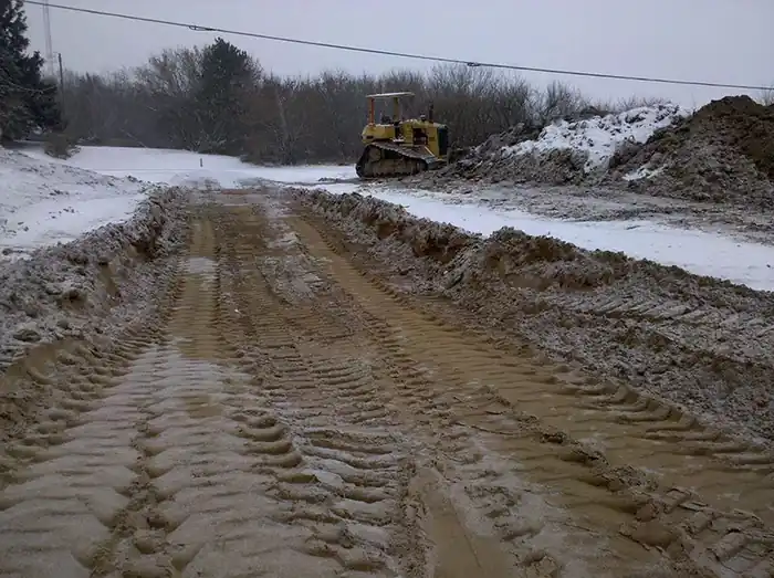 Fresh road grade cut through snow
