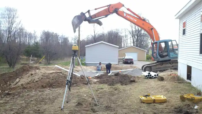 Laser level and rod set over an open septic bed